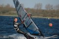Hans finished met een big-smile een van de heats van de regio-cup. <br />Mooie foto, genomen vanuit de wedstrijd boot.